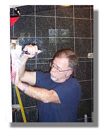 Tom installing a door